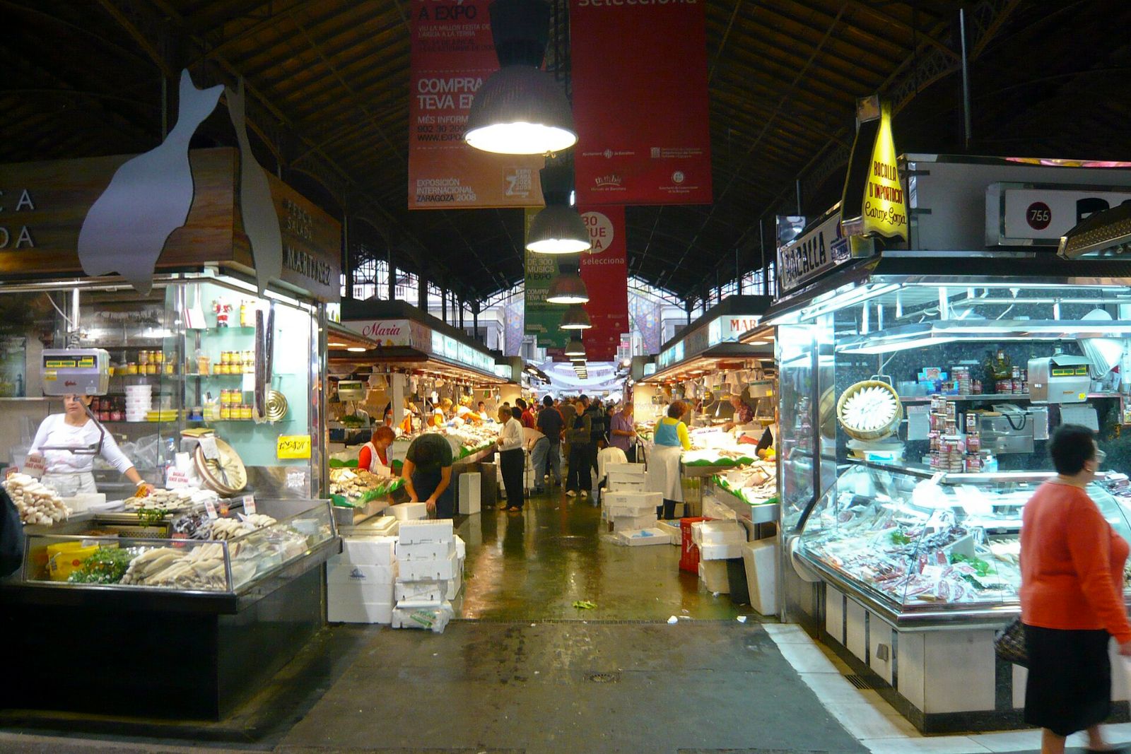 A market stall with produce and handwritten signs